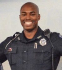 a police officer posing for a photo